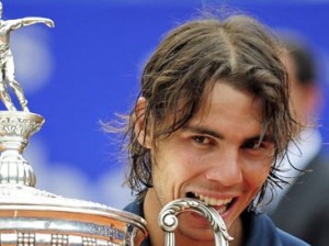 Rafael-Nadal-bites-his-tr-001